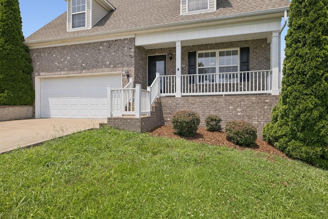 1882 Portway Rd, Spring Hill, TN 37174 - view of front of property featuring roof with shingles, a porch, driveway, a front lawn, and an attached garage