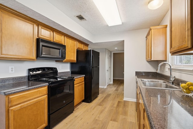 1882 Portway Rd, Spring Hill, TN 37174 - kitchen featuring black appliances, a textured ceiling, and light wood-type flooring