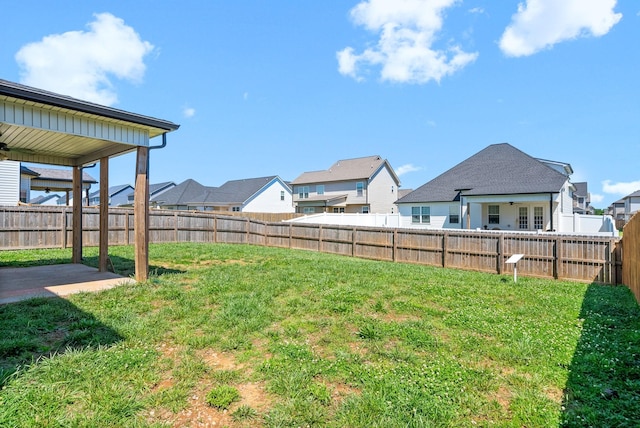 1613 Kestrel Dr, Clarksville, TN 37040 - fenced backyard with a residential view, a patio, and a ceiling fan