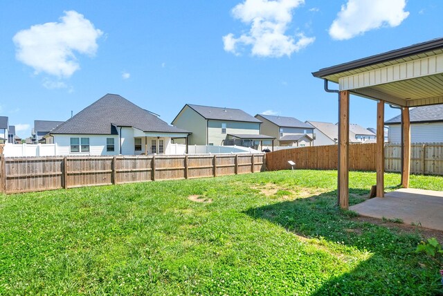1613 Kestrel Dr, Clarksville, TN 37040 - fenced backyard featuring a patio and a residential view