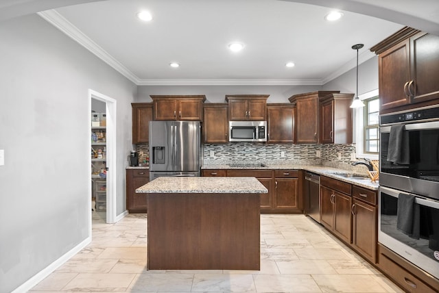 1613 Kestrel Dr, Clarksville, TN 37040 - kitchen with appliances with stainless steel finishes, light marble finish floors, ornamental molding, light stone counters, and recessed lighting