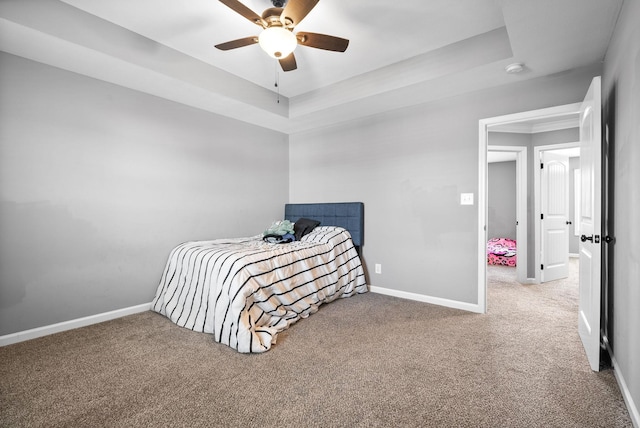 1613 Kestrel Dr, Clarksville, TN 37040 - carpeted bedroom featuring a raised ceiling and ceiling fan