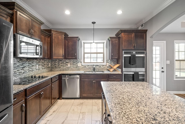 1613 Kestrel Dr, Clarksville, TN 37040 - kitchen with appliances with stainless steel finishes, light stone countertops, light marble finish flooring, arched walkways, and decorative backsplash