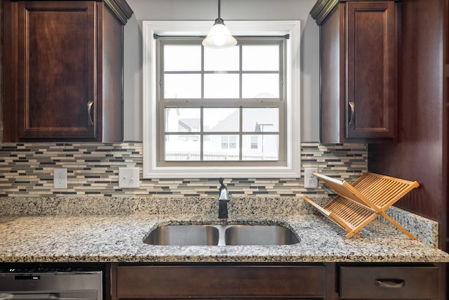 1613 Kestrel Dr, Clarksville, TN 37040 - kitchen featuring dishwashing machine, dark brown cabinetry, decorative backsplash, and light stone counters