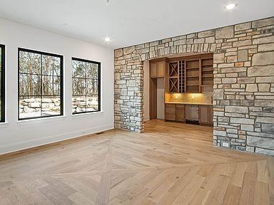 6128 Lookaway Cir, Franklin, TN 37067 - unfurnished living room with baseboards and recessed lighting