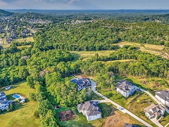 6128 Lookaway Cir, Franklin, TN 37067 - aerial view of property and surrounding area with a forest