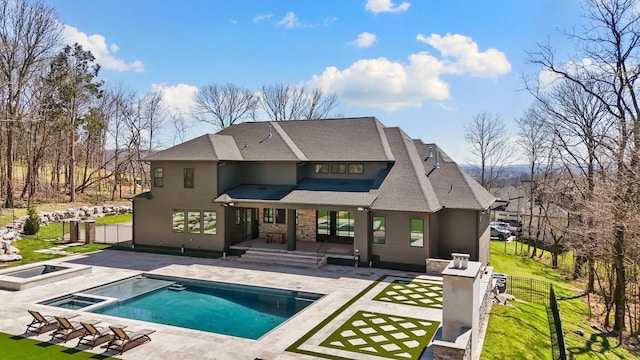 6128 Lookaway Cir, Franklin, TN 37067 - back of property with stucco siding, a patio area, a shingled roof, and a pool with connected hot tub