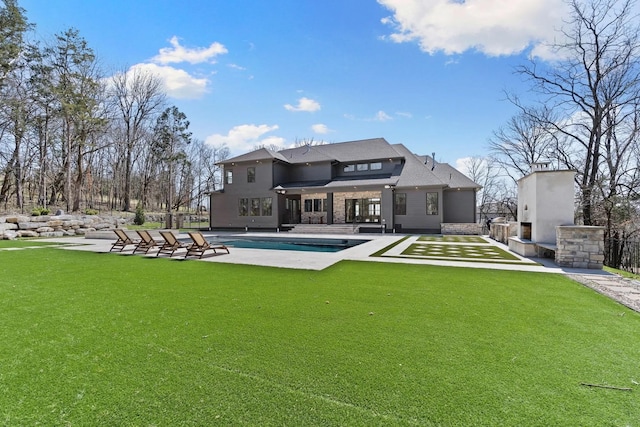 6128 Lookaway Cir, Franklin, TN 37067 - back of house with an outdoor pool, a lawn, and a patio area