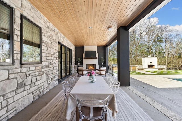 6128 Lookaway Cir, Franklin, TN 37067 - wooden deck featuring a fireplace and a patio area