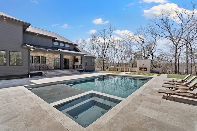 6128 Lookaway Cir, Franklin, TN 37067 - view of pool featuring a patio, an in-ground hot tub, and a lit fireplace