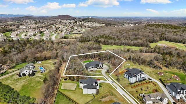6128 Lookaway Cir, Franklin, TN 37067 - aerial perspective of suburban area with property boundaries highlighted and a mountain backdrop