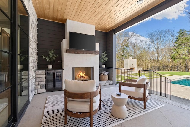6128 Lookaway Cir, Franklin, TN 37067 - view of patio featuring a large fireplace and beverage cooler