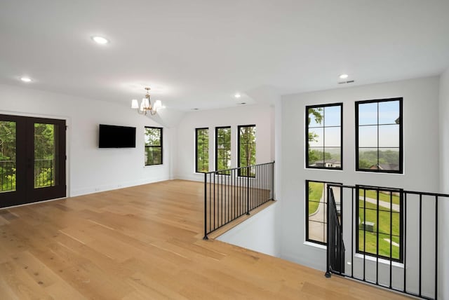 6128 Lookaway Cir, Franklin, TN 37067 - unfurnished room featuring a chandelier, recessed lighting, wood finished floors, and french doors
