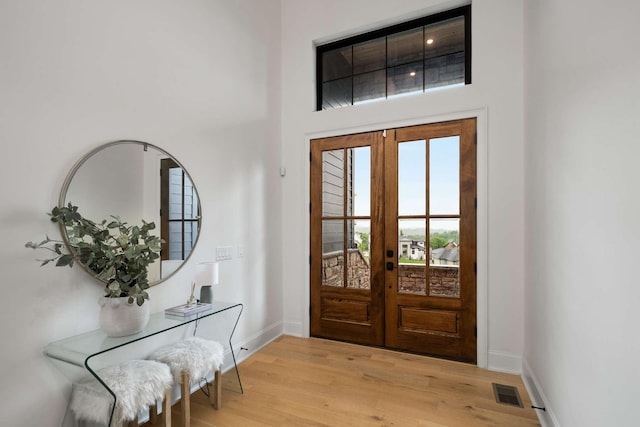 6128 Lookaway Cir, Franklin, TN 37067 - foyer with french doors, light wood-type flooring, and a towering ceiling
