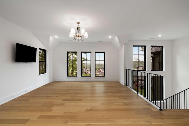 6128 Lookaway Cir, Franklin, TN 37067 - unfurnished living room with a chandelier, recessed lighting, and light wood-style flooring
