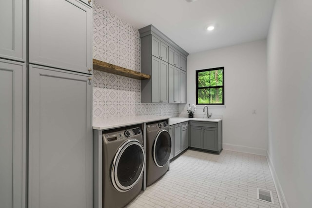 6128 Lookaway Cir, Franklin, TN 37067 - washroom with washer and clothes dryer and cabinet space