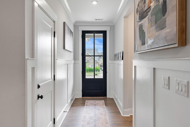 1003 Autumn Ridge Ct, Spring Hill, TN 37174 - doorway with a decorative wall, wood finished floors, and wainscoting