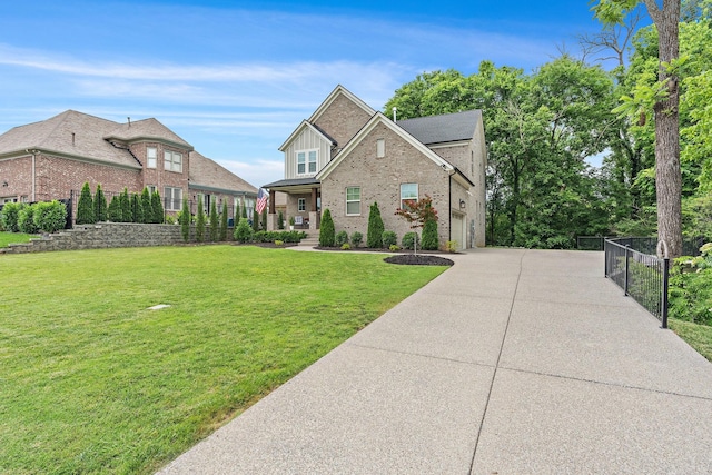 1003 Autumn Ridge Ct, Spring Hill, TN 37174 - view of front of house featuring brick siding, concrete driveway, and a garage