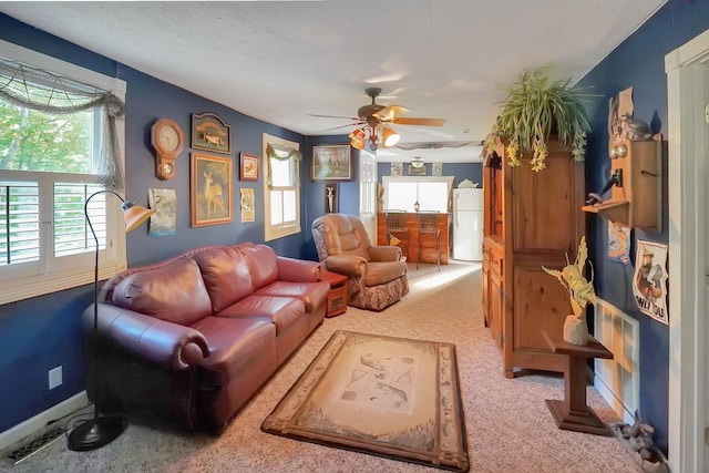 211 Lewis Cir, Dover, TN 37058 - carpeted living room featuring plenty of natural light and a ceiling fan