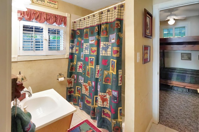 211 Lewis Cir, Dover, TN 37058 - full bath with plenty of natural light, tile patterned floors, and ceiling fan