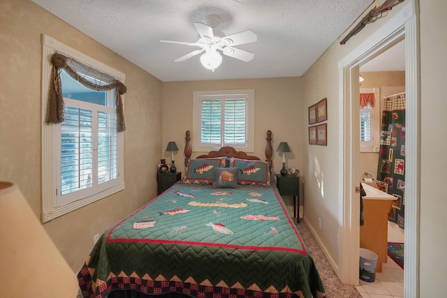 211 Lewis Cir, Dover, TN 37058 - tiled bedroom with a textured ceiling and a ceiling fan