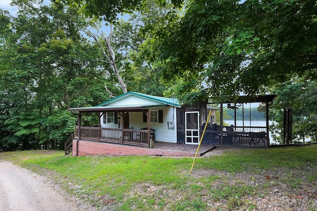 211 Lewis Cir, Dover, TN 37058 - view of front facade featuring a porch, a water view, and a front yard