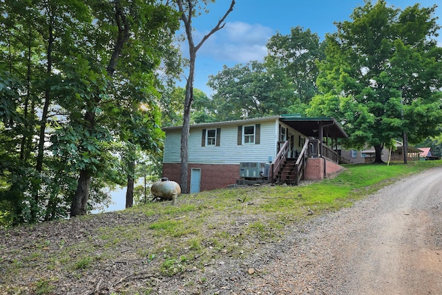 211 Lewis Cir, Dover, TN 37058 - view of front of house featuring stairway and driveway
