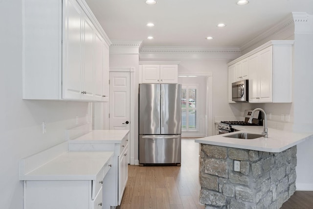 324 Julianna Cir, Franklin, TN 37064 - kitchen with appliances with stainless steel finishes, white cabinetry, recessed lighting, light countertops, and crown molding