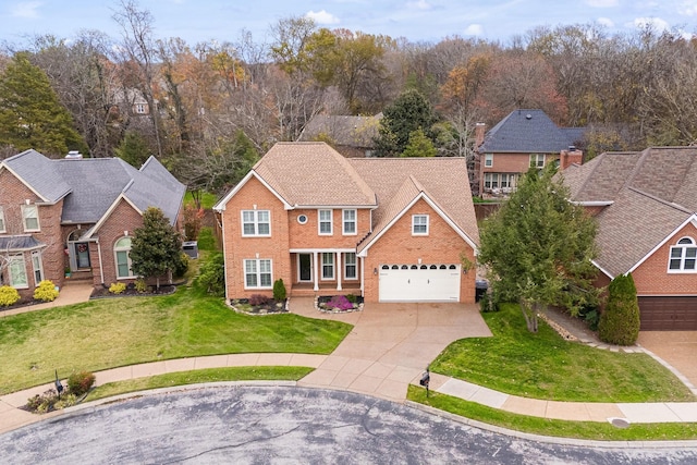 324 Julianna Cir, Franklin, TN 37064 - traditional home with driveway, brick siding, a garage, and a front lawn