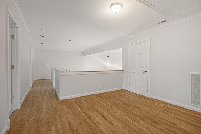 324 Julianna Cir, Franklin, TN 37064 - empty room featuring attic access, light wood finished floors, and crown molding