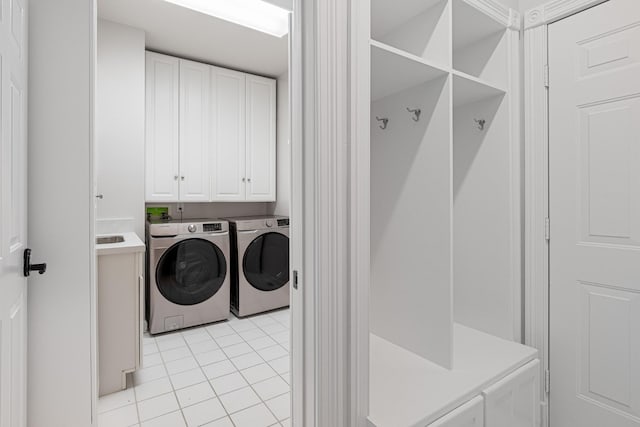 324 Julianna Cir, Franklin, TN 37064 - laundry room featuring independent washer and dryer, cabinet space, and light tile patterned floors