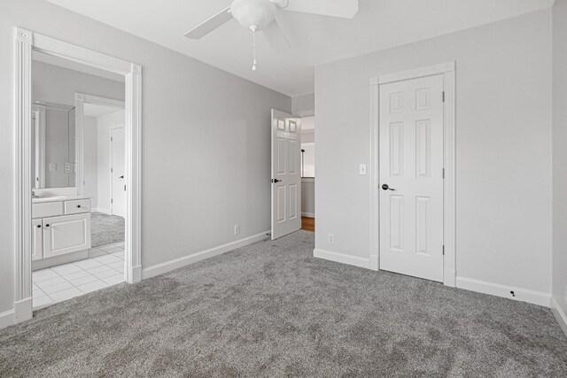 324 Julianna Cir, Franklin, TN 37064 - unfurnished bedroom with light colored carpet, ensuite bath, ceiling fan, and light tile patterned floors