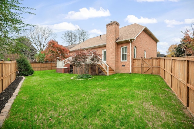 324 Julianna Cir, Franklin, TN 37064 - rear view of house featuring stairway, a chimney, a fenced backyard, brick siding, and a deck