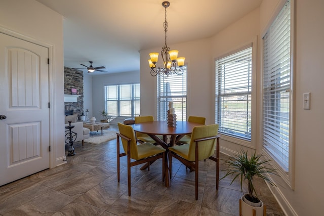 160 Dobson Knob Trl, Nolensville, TN 37135 - dining room with a chandelier, a stone fireplace, and ceiling fan