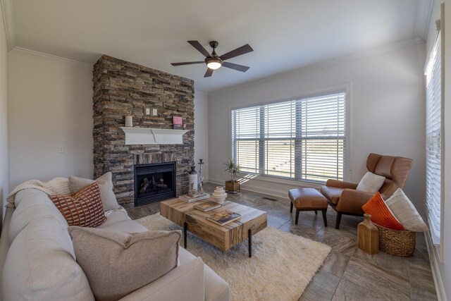 160 Dobson Knob Trl, Nolensville, TN 37135 - tiled living area with crown molding, ceiling fan, and a stone fireplace