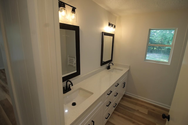 151 Dawn St, Morrison, TN 37357 - full bath featuring double vanity, a textured ceiling, and wood finished floors