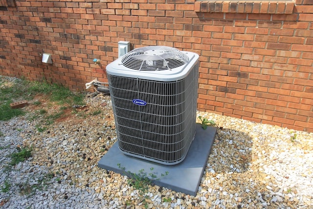 151 Dawn St, Morrison, TN 37357 - exterior view of a central AC unit and brick siding