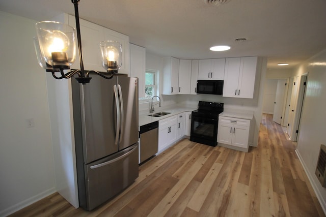 151 Dawn St, Morrison, TN 37357 - kitchen featuring black appliances, white cabinets, and light countertops