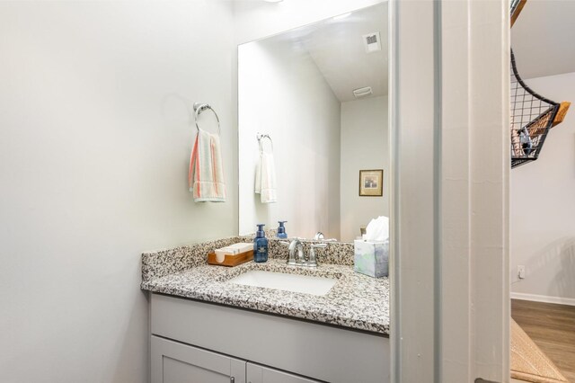 414 Manor Row, Pleasant View, TN 37146 - bathroom featuring vanity and wood finished floors