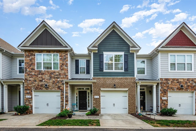 414 Manor Row, Pleasant View, TN 37146 - multi unit property featuring stone siding, concrete driveway, a garage, and board and batten siding