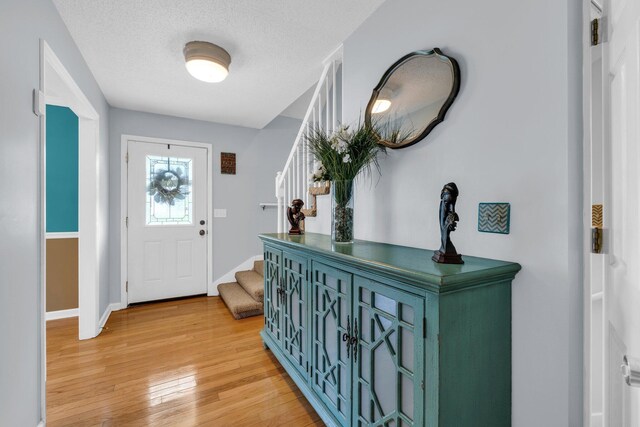 1128 Tiftonia View Rd, Chattanooga, TN 37419 - foyer with stairs, light wood finished floors, and a textured ceiling