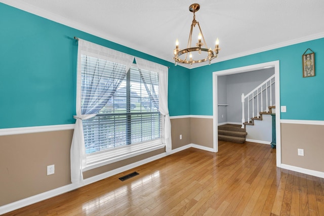 1128 Tiftonia View Rd, Chattanooga, TN 37419 - unfurnished room featuring a chandelier, wood-type flooring, stairs, and ornamental molding