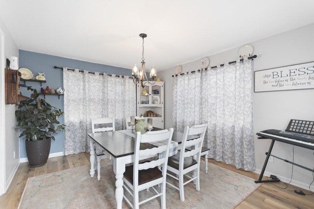70 Nancy Ave, Cadiz, KY 42211 - dining area with a chandelier and wood finished floors