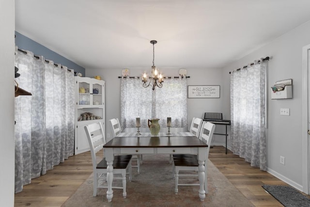 70 Nancy Ave, Cadiz, KY 42211 - dining space featuring a chandelier, plenty of natural light, and wood finished floors