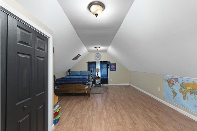 70 Nancy Ave, Cadiz, KY 42211 - bedroom featuring light wood-type flooring and vaulted ceiling