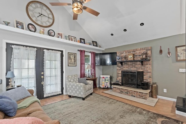 70 Nancy Ave, Cadiz, KY 42211 - living room featuring high vaulted ceiling, wood finished floors, a fireplace, and a ceiling fan