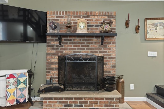70 Nancy Ave, Cadiz, KY 42211 - detailed view of a brick fireplace and wood finished floors