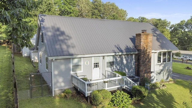 70 Nancy Ave, Cadiz, KY 42211 - back of property featuring a chimney, a metal roof, and a gate