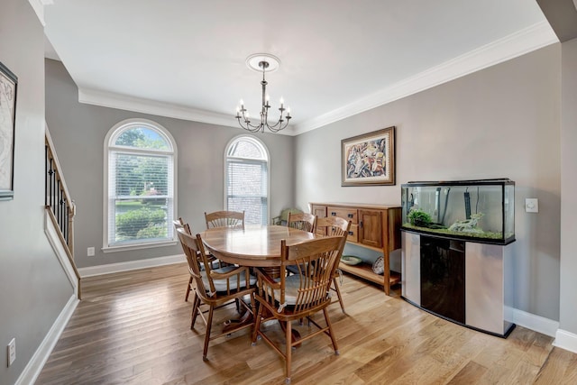 206 Stillcreek Dr, Franklin, TN 37064 - dining space featuring crown molding, light wood-style flooring, and a chandelier