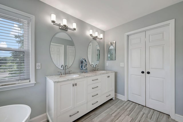206 Stillcreek Dr, Franklin, TN 37064 - bathroom featuring double vanity and a soaking tub
